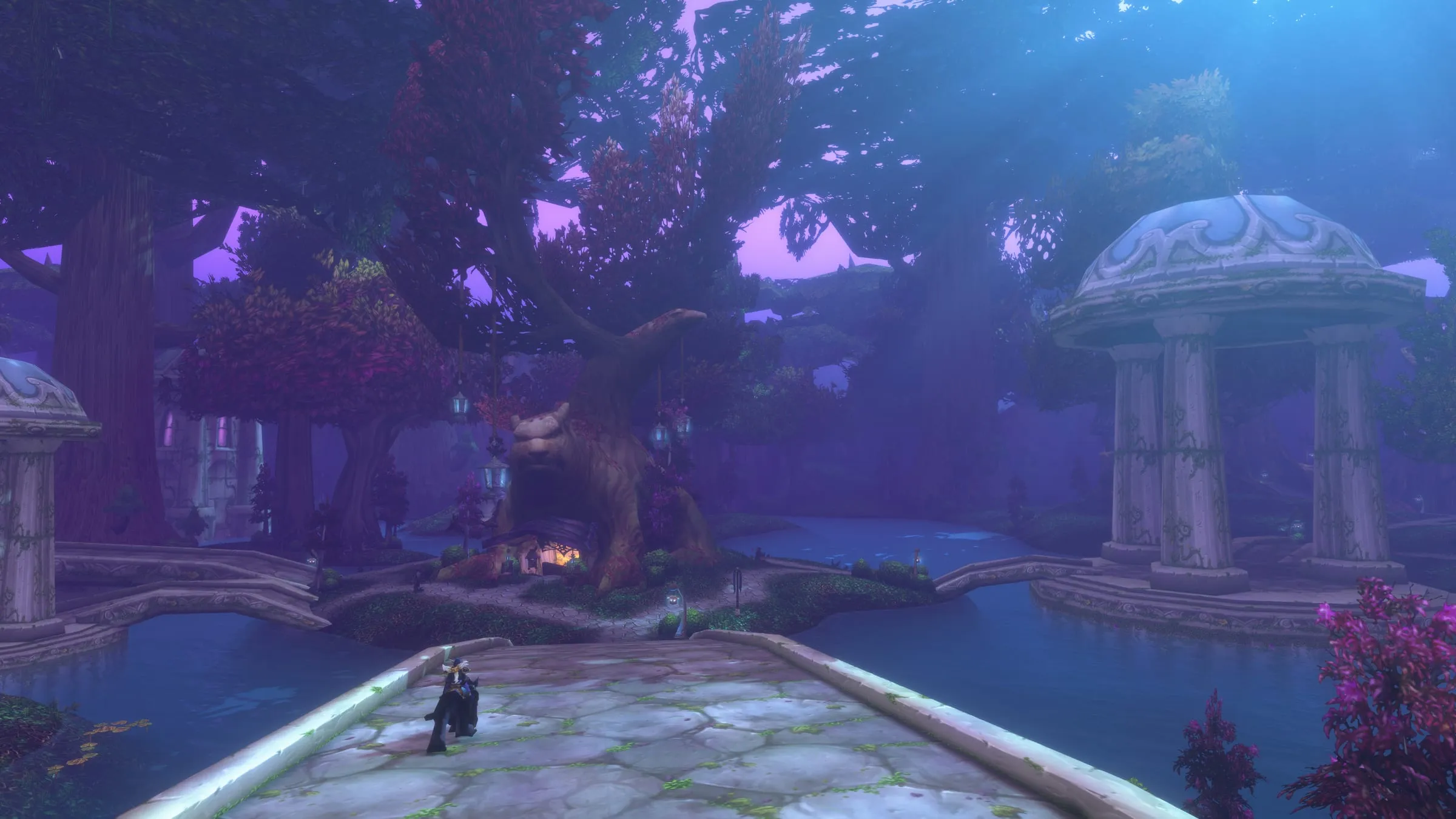 Darnassus at night: pale pavilions and still water beneath a violet canopy