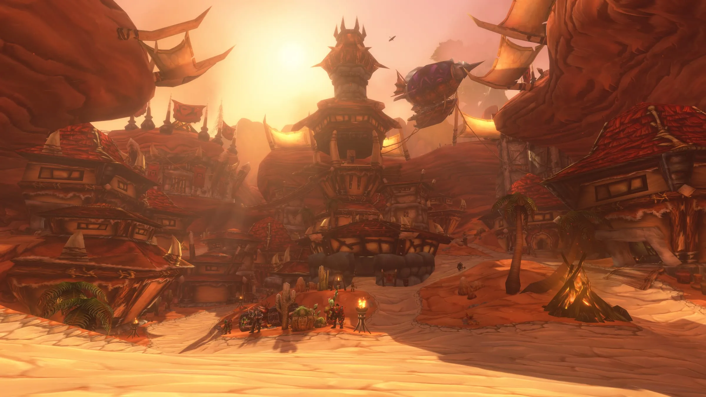 Orgrimmar: canyon rooftops and braziers lit by a low sun