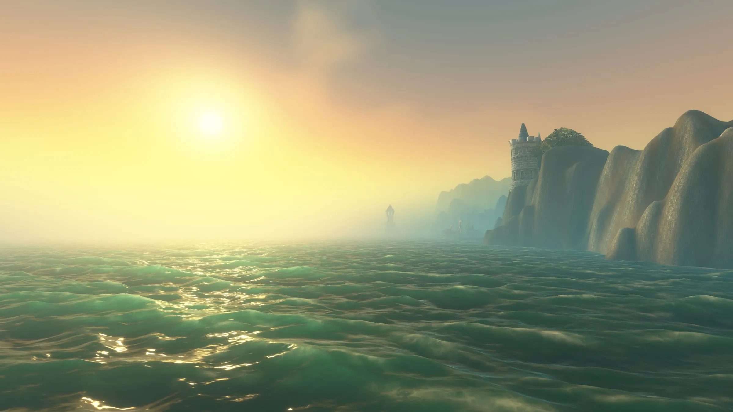 Sunlight scattering across open water beside a cliff face